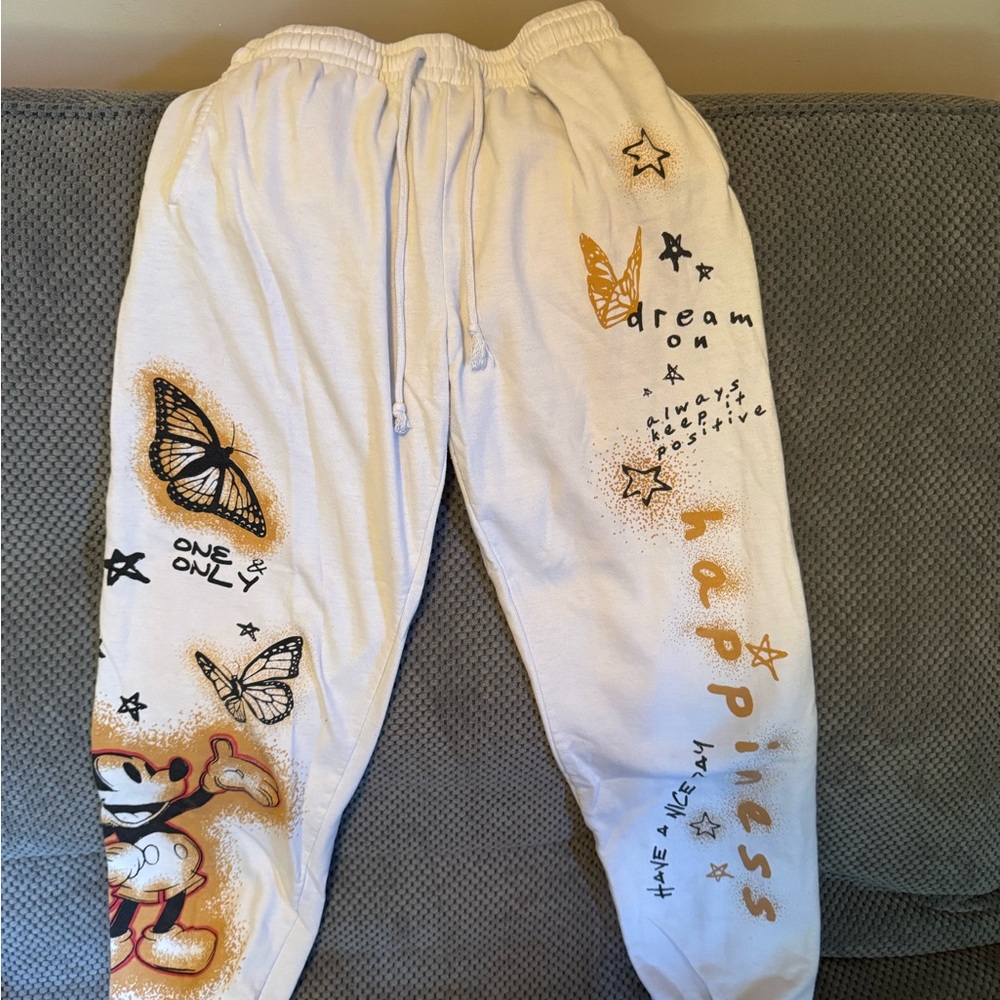 Disney White Graphic Sweatpants with Orange and Black Accents